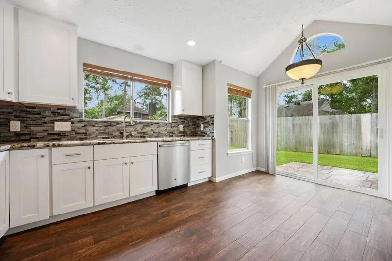 Updated kitchen with sliding door to the backyard