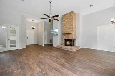 Living room with brick fireplace